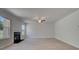 Bright living room featuring a fireplace, ceiling fan, and light-colored wood flooring at 281 Chiswick Loop, Stockbridge, GA 30281