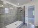 Glass enclosed shower features tiled walls, a bench, and modern fixtures at 281 Chiswick Loop, Stockbridge, GA 30281