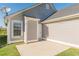 A cozy backyard patio extends from a home with gray siding at 363 Chadwick Cmn, Stockbridge, GA 30281