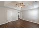 Large bedroom with tray ceilings and ceiling fan, with doors to the closet and bathroom at 363 Chadwick Cmn, Stockbridge, GA 30281