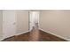 A spacious bedroom featuring laminate floors is brightened by natural light at 363 Chadwick Cmn, Stockbridge, GA 30281