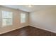 This bright bedroom features laminate floors and is illuminated by two sunny windows at 363 Chadwick Cmn, Stockbridge, GA 30281