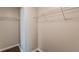 Walk-in closet with built-in shelving and hardwood floors providing ample storage space at 363 Chadwick Cmn, Stockbridge, GA 30281