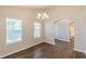 Bright dining room with hardwood floors and a doorway to the bathroom at 363 Chadwick Cmn, Stockbridge, GA 30281