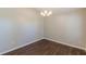 Well-lit dining room boasting new hardwood floors and a stylish chandelier at 363 Chadwick Cmn, Stockbridge, GA 30281
