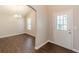 Bright entryway with hardwood floors and elegant archway leading to dining area at 363 Chadwick Cmn, Stockbridge, GA 30281