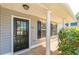 Inviting covered porch with elegant columns and a stylish front door at 363 Chadwick Cmn, Stockbridge, GA 30281