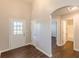 Hallway featuring hardwood floors and doorways to other rooms at 363 Chadwick Cmn, Stockbridge, GA 30281