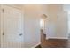 Neutral hallway with archway and hardwood floors at 363 Chadwick Cmn, Stockbridge, GA 30281