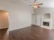 Bright living room boasts a ceiling fan and fireplace, creating a cozy and inviting atmosphere at 363 Chadwick Cmn, Stockbridge, GA 30281