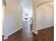 Spacious living room with neutral walls, hardwood floors and an archway to the kitchen at 363 Chadwick Cmn, Stockbridge, GA 30281