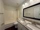 Bathroom with a double vanity, granite countertop, and shower-tub combination at 363 Chadwick, Stockbridge, GA 30281