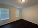 Bright, airy bedroom with natural light and dark flooring at 363 Chadwick, Stockbridge, GA 30281