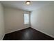This bedroom features a window and dark floors at 363 Chadwick, Stockbridge, GA 30281