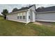 Side view of house showing siding and well-maintained lawn at 363 Chadwick, Stockbridge, GA 30281