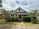 Charming single-Gathering home featuring manicured landscaping and a welcoming front porch at 363 Chadwick, Stockbridge, GA 30281
