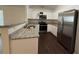 Modern kitchen with granite countertops, stainless steel appliances, and white cabinetry at 363 Chadwick, Stockbridge, GA 30281