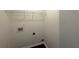 The laundry room has hookups and white walls at 363 Chadwick, Stockbridge, GA 30281