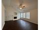 Cozy living room featuring a fireplace, vaulted ceilings, and multiple windows for ample natural light at 363 Chadwick, Stockbridge, GA 30281