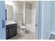 Well-lit bathroom featuring a sink, toilet, and bathtub/shower combo at 4183 May Apple Ln, Atlanta, GA 30349