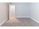 Cozy bedroom featuring neutral-colored walls, carpet, and white trim at 4183 May Apple Ln, Atlanta, GA 30349