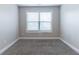 Bedroom with neutral carpet and window with blinds at 4183 May Apple Ln, Atlanta, GA 30349