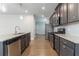 Galley style kitchen offers granite countertops and stainless steel appliances at 4183 May Apple Ln, Atlanta, GA 30349