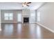 Spacious living room featuring a fireplace and hardwood floors at 4183 May Apple Ln, Atlanta, GA 30349