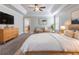 Beautiful primary bedroom with a ceiling fan and stylish furniture at 4183 May Apple Ln, Atlanta, GA 30349