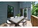 Outdoor dining area with a modern table and chairs on a wooden deck, perfect for summer barbecues at 140 Racine Sw St, Atlanta, GA 30314