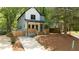 Charming two-story home with modern farmhouse style and a well-manicured front yard and inviting front porch at 140 Racine Sw St, Atlanta, GA 30314