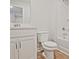 Clean bathroom with a modern tub, toilet, and vanity with storage at 162 Bluffington Way, Marietta, GA 30066