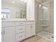 Modern bathroom with double sink vanity, large mirror, and glass enclosed shower at 162 Bluffington Way, Marietta, GA 30066