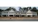 Newly built townhomes featuring varied architectural styles and attached garages, presenting a modern community aesthetic at 162 Bluffington Way, Marietta, GA 30066