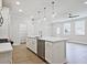 Bright, open-concept kitchen with white cabinets, island, stainless steel appliances, and pantry space at 162 Bluffington Way, Marietta, GA 30066