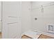 Functional laundry room with washer/dryer hookups and shelving at 162 Bluffington Way, Marietta, GA 30066