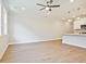Bright living room with recessed lighting, wood-look floors, views to the kitchen, and multiple windows at 162 Bluffington Way, Marietta, GA 30066
