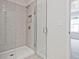 Modern shower with gray tile and built-in shower caddy at 162 Bluffington Way, Marietta, GA 30066