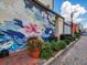 Street art enhances the community with colorful murals and vibrant flower pots along the sidewalks at 162 Bluffington Way, Marietta, GA 30066