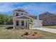 Attractive two-story home with fresh landscaping, an attached garage, and a well-maintained front yard at 257 Chiswick Loop, Stockbridge, GA 30281