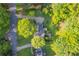 Aerial view showcasing the property's landscaping, driveway, and surrounding lush greenery at 288 Shire Way, Lawrenceville, GA 30044
