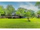 Sprawling backyard featuring a well-maintained lawn and inviting wood deck at 288 Shire Way, Lawrenceville, GA 30044