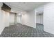 Finished basement with TV, neutral paint, carpet, and walk in closet with shelves at 288 Shire Way, Lawrenceville, GA 30044