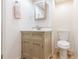 Traditional powder room with pedestal sink, wood paneling and classic neutral tones at 288 Shire Way, Lawrenceville, GA 30044