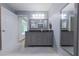 Beautiful bathroom with dual vanities, updated fixtures, tile flooring and blue walls and a doorway at 288 Shire Way, Lawrenceville, GA 30044