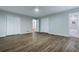 Primary bedroom boasts hardwood floors, neutral paint and an ensuite bathroom with tile flooring and a tub at 288 Shire Way, Lawrenceville, GA 30044