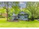 Charming two-story home featuring mature trees, a cozy front porch, and beautiful landscaping at 288 Shire Way, Lawrenceville, GA 30044