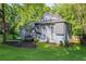 Spacious home showcasing the yard, landscaping, mature trees, and stylish exterior at 288 Shire Way, Lawrenceville, GA 30044
