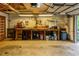 Spacious garage with workbench, tools, ample storage, and garage door at 288 Shire Way, Lawrenceville, GA 30044