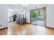 Open concept living area with a kitchen island and access to a deck through sliding glass doors at 288 Shire Way, Lawrenceville, GA 30044